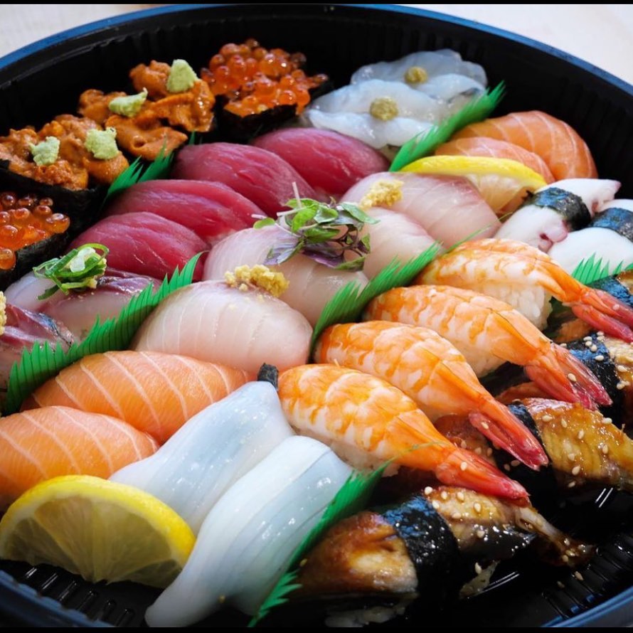 Assorted sushi rolls, nigiri, sides featured by Sushi Train
